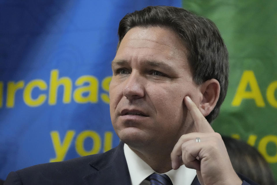 FILE - Florida Gov. Ron DeSantis listens to a question during a press conference Sept. 7, 2022, in Miami, Fla. The Republican governors of Florida and Texas have delivered migrants on planes and buses to Washington, D.C., New York City and even Martha's Vineyard, but they may just be getting started. (AP Photo/Rebecca Blackwell, File)