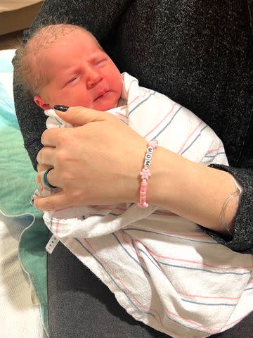 <p>Reading Hospital - Tower Health</p> Mom with Taylor Swift bracelet and her newborn