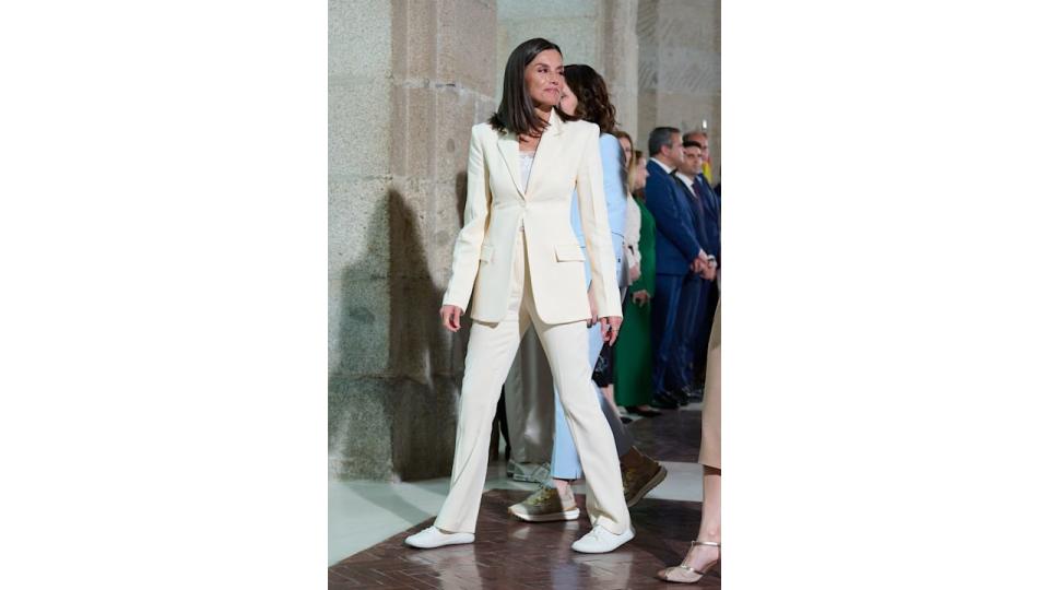 Queen Letizia in a white suit look with lacy cami