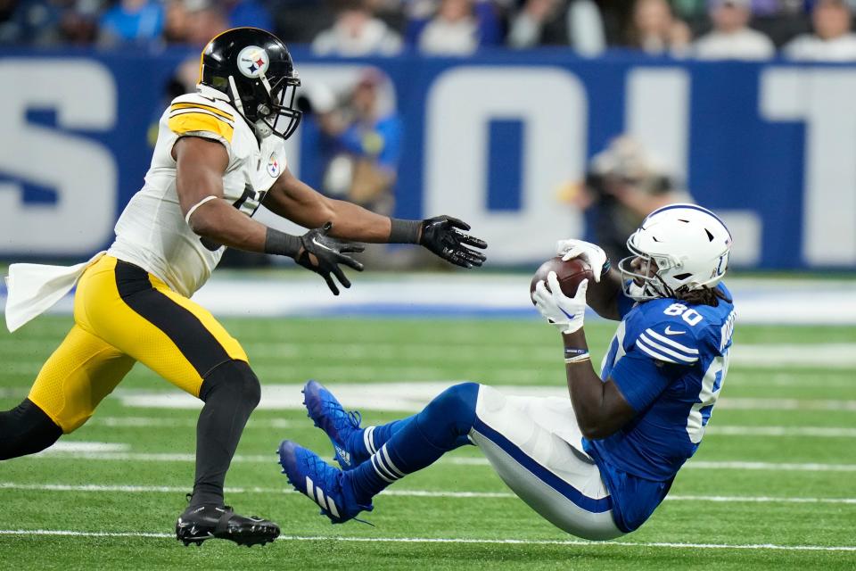 Indianapolis Colts' Jelani Woods (80) is tackled by Pittsburgh Steelers' Myles Jack (51) during the second half of an NFL football game, Monday, Nov. 28, 2022, in Indianapolis.