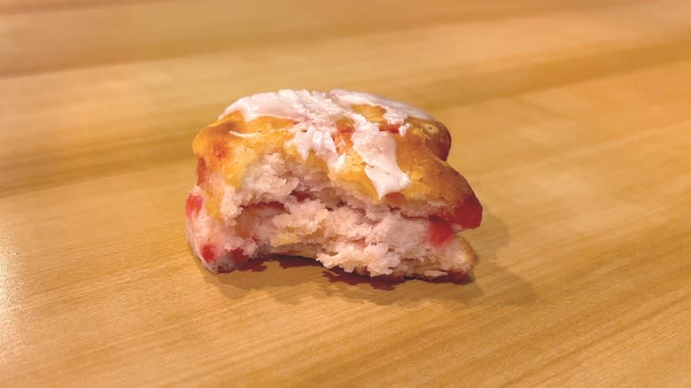 bitten strawberry biscuit