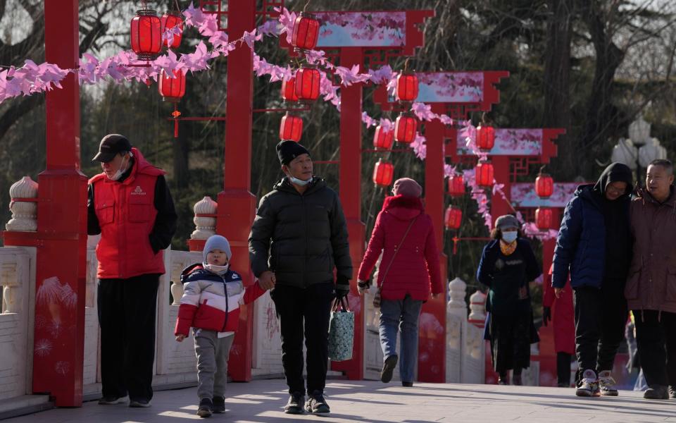 Visitors to a park in Beijing on New Year's Eve