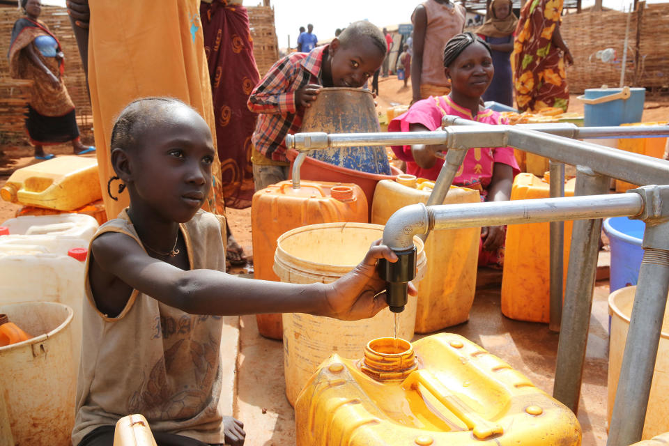 <p>New arrivals at the protection of civilians (PoC) site access to water in Wau, South Sudan, April 20, 2017. A recent upsurge in violence beginning April 10 has displaced thousands of people in South Sudan’s Wau town. Between April 10 and 12, approximately 4,000 people arrived at the PoC site adjacent to the UN Mission in South Sudan base, joining more than 25,200 internally displaced persons already seeking refuge in the site. (Photo: Nektarios Markogiannis/UN) </p>