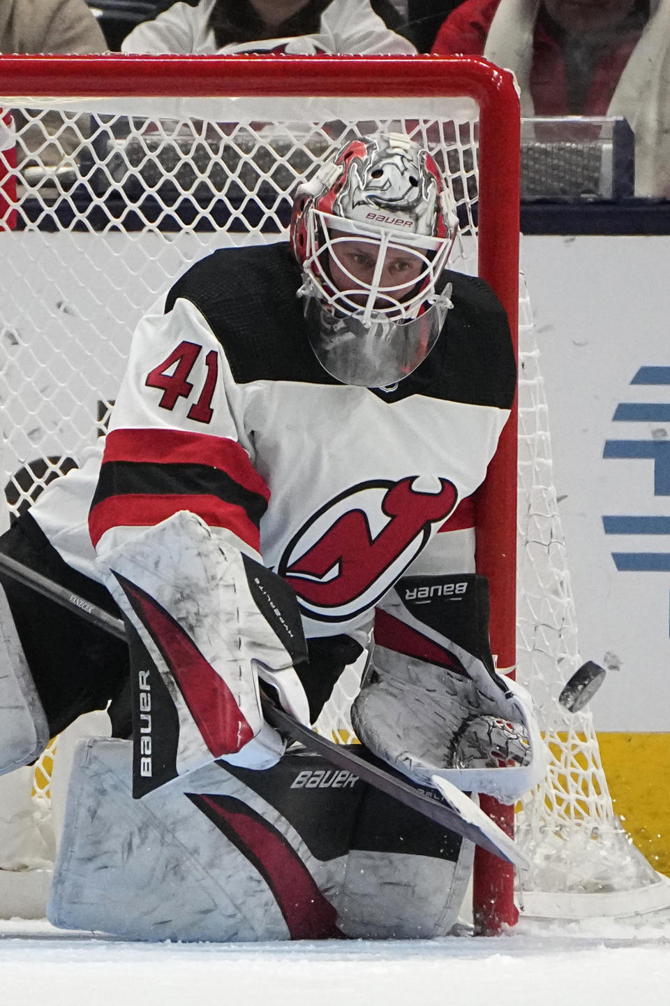 New Jersey Devils goaltender Vitek Vanecek blocks a shot during the third period of the team's NHL hockey game against the Columbus Blue Jackets onFriday, Jan. 19, 2024, in Columbus, Ohio. (AP Photo/Sue Ogrocki)