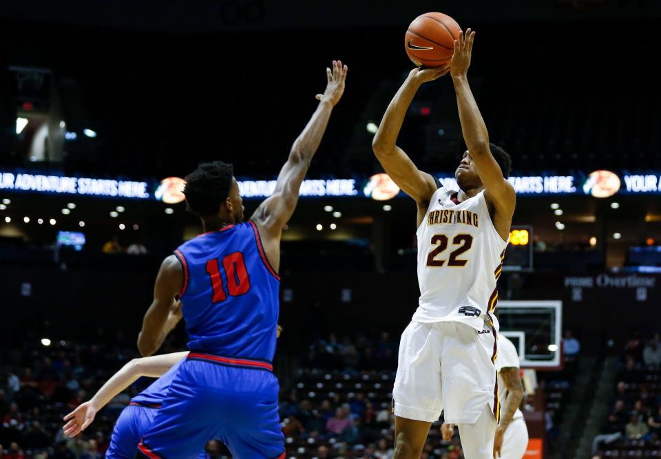 Christ the King's Devin Vanterpool shoots a field goal over Bartlett Panthers Charvez Ambrose during the Bass Pro Shops Tournament of Champions at Great Southern Bank Arena on Thursday, Jan. 12, 2023.