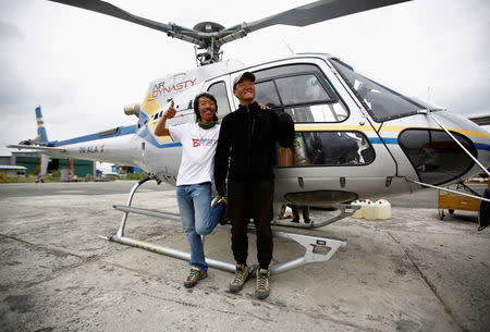 Phurba Tenzing Sherpa (L), who says it's his 10th Everest summit, poses for a picture with Chinese climber Liu Lei after returning from Mount Everest summit in Kathmandu, Nepal, May 24, 2016. REUTERS/Navesh Chitrakar