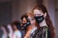 Models wear creations as part of the Francesco Liberatore 2021 women's spring-summer ready-to-wear collection during the Milan's fashion week in Milan, Italy, Friday, Sept. 25, 2020. (AP Photo/Antonio Calanni)