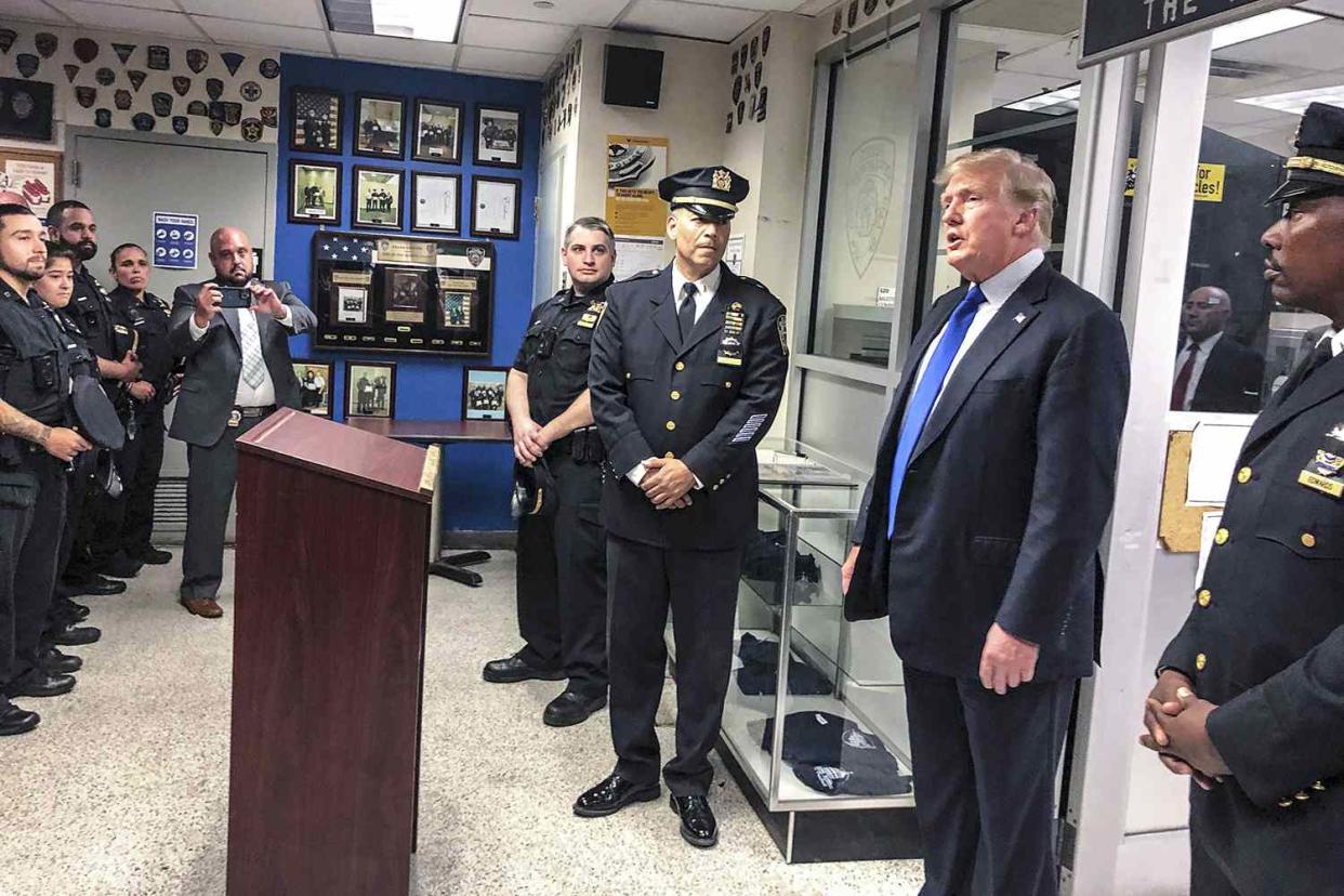 Former President Donald Trump, second from right, commemorated the 20th anniversary of the Sept. 11 attacks by visiting the NYPD's 17th police precinct in New York, where he criticized President Biden over the pullout from Afghanistan Sept 11 20th Anniversary, New York, United States - 11 Sep 2021