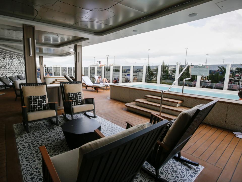 Regent Seven Seas Cruises Grandeur's 
chairs next to hot tubs