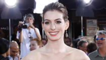 <p>Anne Hathaway got her big break with “The Princess Diaries” in 2001 and has been acting ever since. Her biggest box-office hits include”The Devil Wears Prada,” “Les Misérables,” “Interstellar,” “Alice in Wonderland” and “The Dark Knight Rises” — which alone raked in over $448 million in lifetime gross, according to Box Office Mojo.</p> <p>Not only was “Les Misérables” one of Hathaway’s most successful films at the box office, but it also earned her the Oscar for best actress in a supporting role for her portrayal of Fantine. Hathway was previously nominated for the best actress Oscar for “Rachel Getting Married.”</p> <p><em><strong>Read: <a href="https://www.gobankingrates.com/net-worth/celebrities/celebrities-who-pay-it-forward/" rel="nofollow noopener" target="_blank" data-ylk="slk:36 Celebrities Who Use Their Wealth to Pay It Forward;elm:context_link;itc:0;sec:content-canvas" class="link ">36 Celebrities Who Use Their Wealth to Pay It Forward</a></strong></em></p>