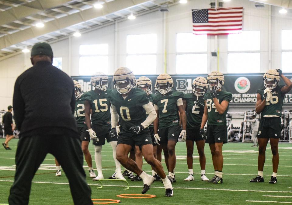 MSU WR Keon Coleman (0) and his Spartan offense run drills Tuesday, March 14, 2023, during the first day of spring practice at the indoor football facilty in East Lansing.