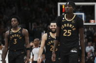 Toronto Raptors' Fred VanVleet, center, walks to the bench for a timeout as his team takes on the Dallas Mavericks during second-half NBA basketball game action in Toronto, Saturday, Nov. 26, 2022. (Chris Young/The Canadian Press via AP)