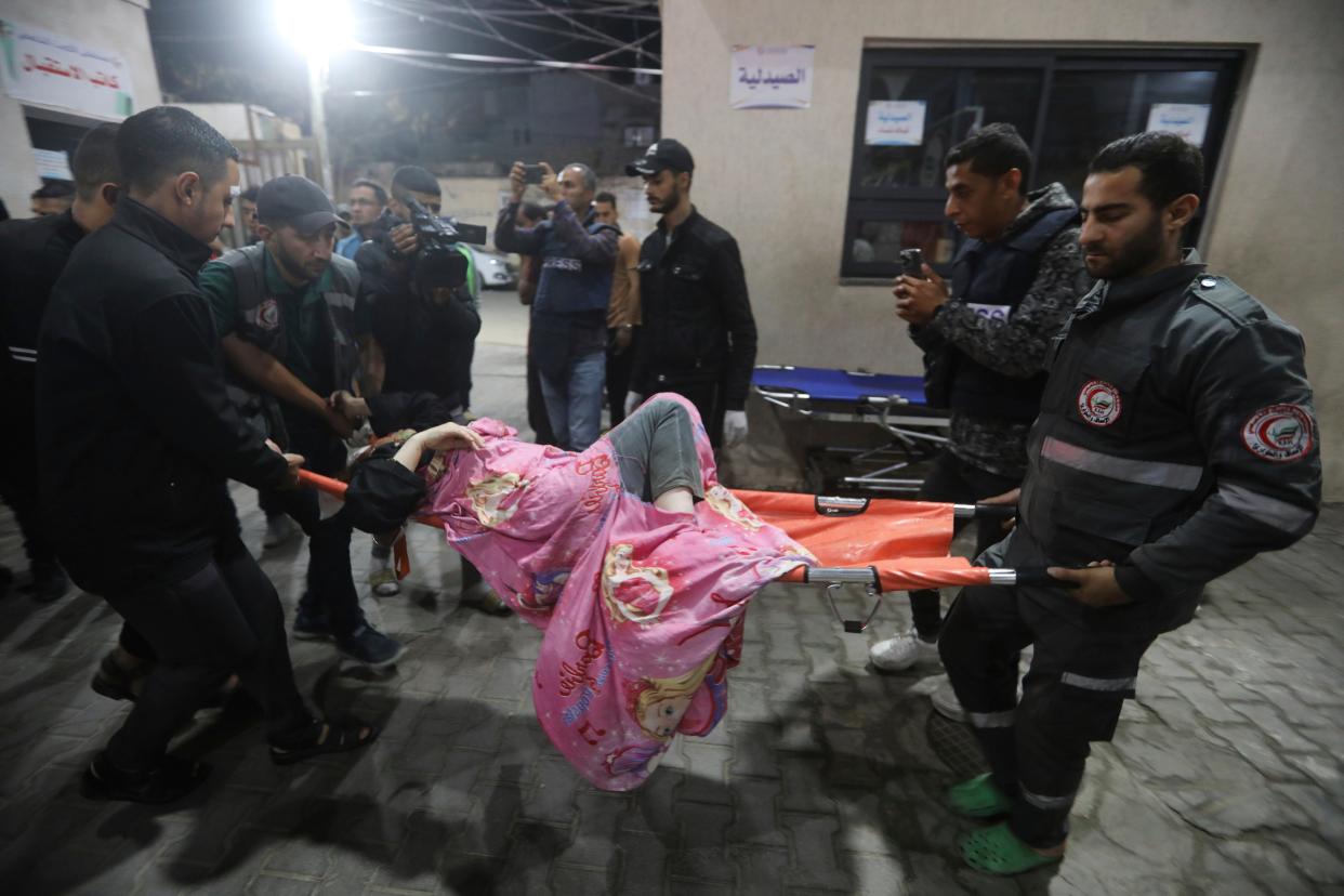 A Palestinian wounded in the Israeli bombardment of the Gaza Strip is brought to a hospital in Rafah, southern Gaza Strip (AP)