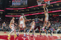 Atlanta Hawks forward Jalen Johnson (1) grabs the rebound during the first half of an NBA basketball game against the Detroit Pistons, Wednesday, April 3, 2024, in Atlanta. (AP Photo/Jason Allen)