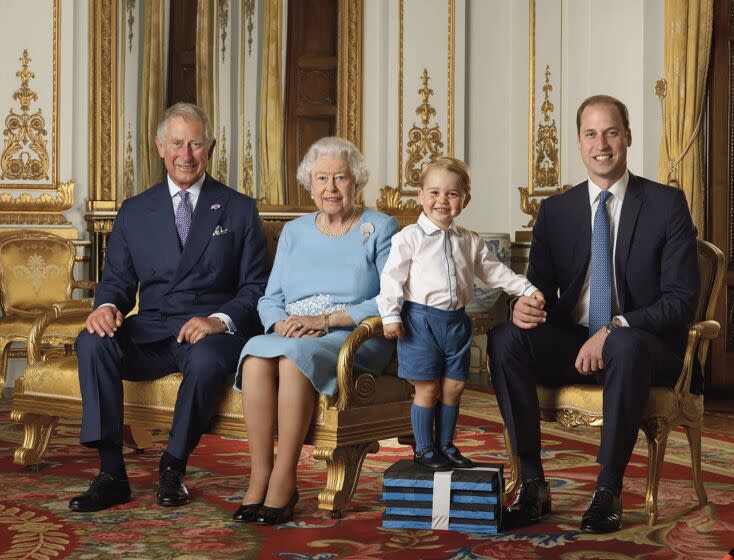 In this file handout photo provided by Buckingham Palace and released in 2016, Queen Elizabeth, Prince Charles, Prince William and Prince George pose for a photo to mark the Queen's 90th birthday, in the White Drawing Room at Buckingham Palace, London. (Ranald Mackechnie/Buckingham Palace via AP)