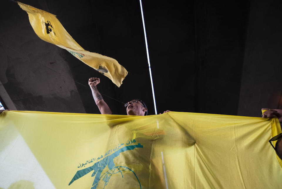 A Hezbollah and Amal supporter shouts slogans against Israel and U.S. during a protest in the southern suburb of Beirut, Lebanon, Sunday, June 28, 2020. The protest came hours after Lebanon's foreign minister summoned the U.S. ambassador to Beirut over comments, she made recently in which she criticized Hezbollah. The meeting between Foreign Minister Nassif Hitti and Ambassador Dorothy Shea is scheduled for Monday afternoon. (AP Photo/Hassan Ammar)