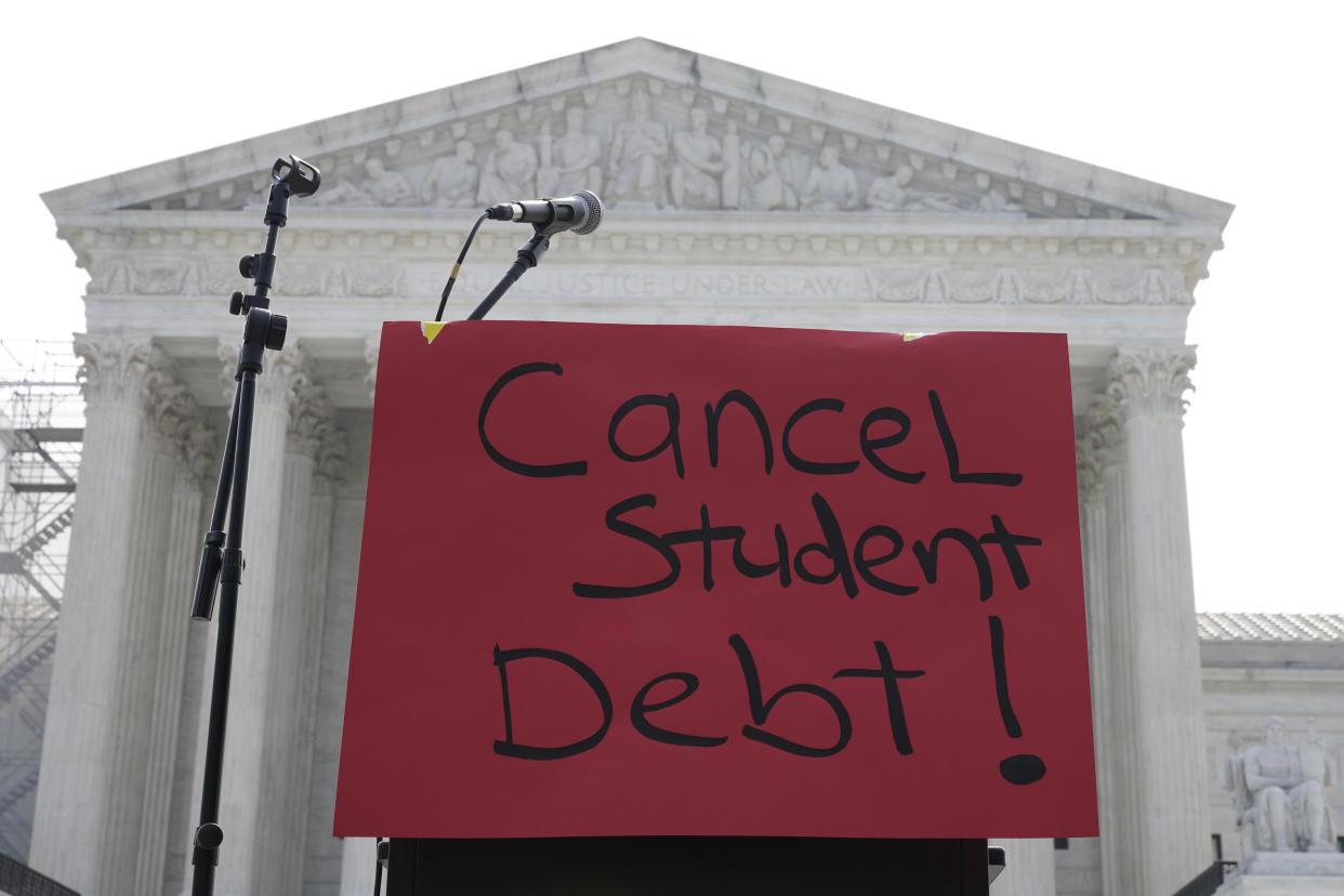 A sign reading "cancel student debt" is seen outside the Supreme Court, Friday, June 30, 2023, as decisions are expected in Washington. (AP Photo/Mariam Zuhaib)