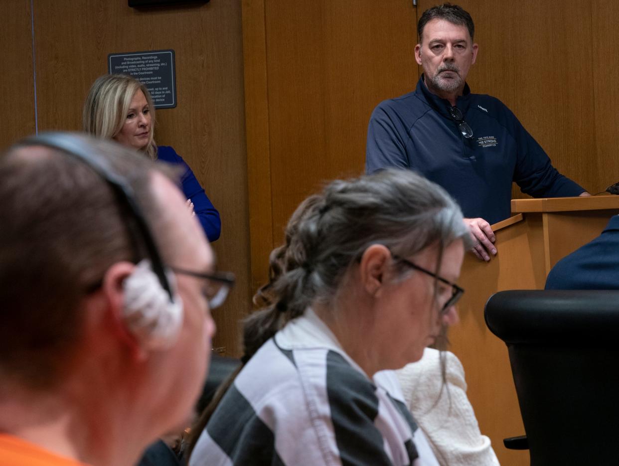 James Crumbley, left, sits with his wife Jennifer Crumbley as Buck Myre reads a victim impact statement in the Oakland County courtroom of Judge Cheryl Matthews on Tuesday, April 9, 2024 before the Crumbleys are sentenced. The Crumbleys are the parents of the Oxford High School shooter from 2021, and both were found guilty each on four counts of involuntary manslaughter.