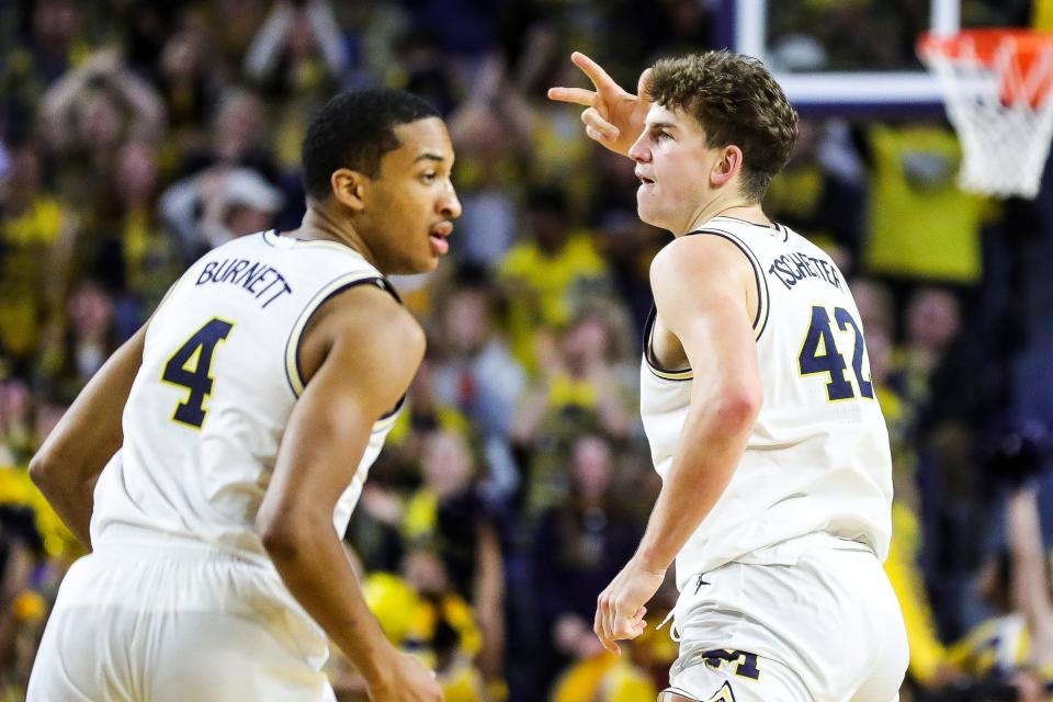 Michigan forward Will Tschetter, right, celebrates a 3-point basket against the Indiana during the second half of U-M's 78-75 loss on Tuesday, Dec. 5, 2023, at Crisler Center.