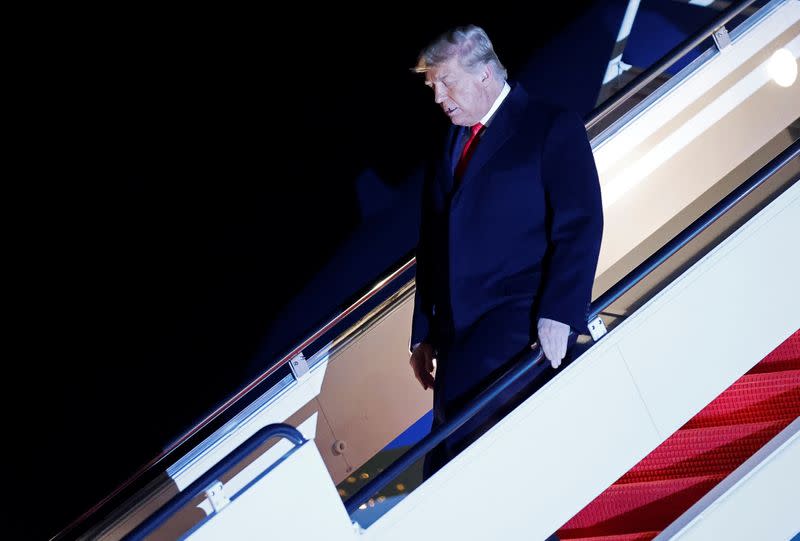 U.S. President Donald Trump disembarks from Air Force One at Joint Base Andrews in Maryland