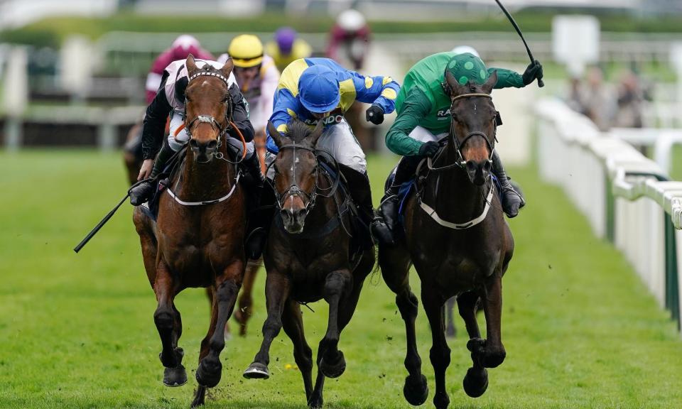 <span>Impaire Et Passe (right) battles with Langer Dan (centre) and Bob Olinger (left) down the finishing straight.</span><span>Photograph: Alan Crowhurst/Getty Images</span>