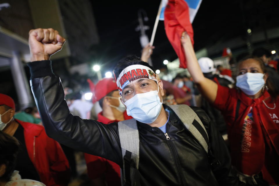 Supporters of Liberty and Refoundation Party gather in support of Honduras' President-elect Xiomara Castro in Tegucigalpa, Honduras, Saturday, Jan. 22, 2022. Castro has seen her prospects of a successful administration take a hit even before she's been inaugurated, as a battle for leadership of the newly elected Congress devolved into shouting and shoving among her own allies on Friday. (AP Photo/Elmer Martinez)