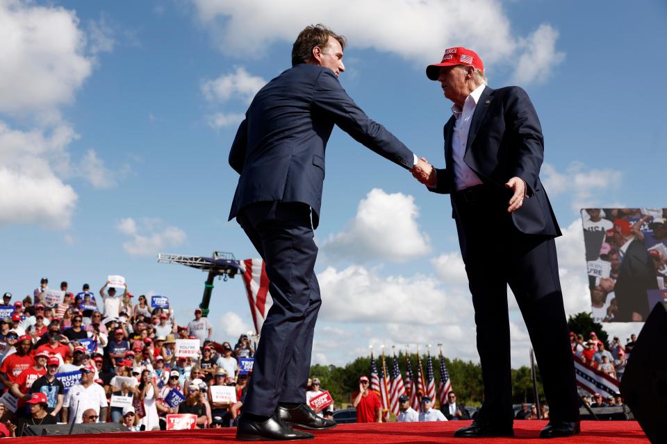 CHESAPEAKE, VIRGINIA - JUNE 28: Republican presidential candidate, former U.S. President Donald Trump shakes hands with Virginia Gov. Glenn Youngkin during a rally at Greenbrier Farms on June 28, 2024 in Chesapeake, Virginia. Last night Trump and U.S. President Joe Biden took part in the first presidential debate of the 2024 campaign. (Photo by Anna Moneymaker/Getty Images)