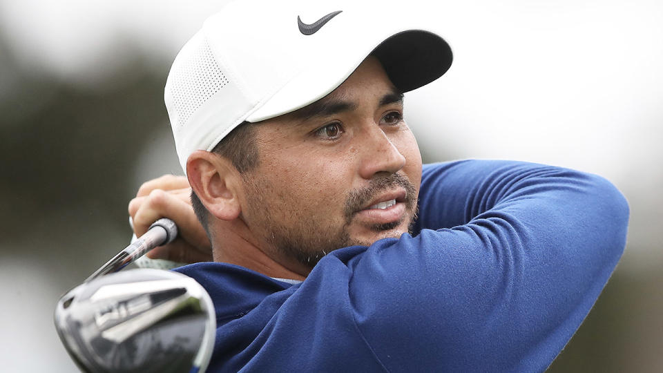 Jason Day looks on after a drive.