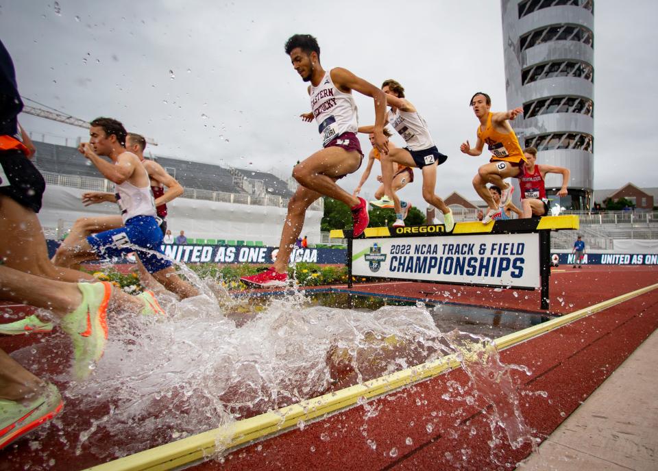 Eastern Kentucky’s Ahmed Jaziri splashes through the water jump on his way to winning the men’s 3,000 meter steeplechase on the third day of the NCAA Outdoor Track & Field Championships Friday, June 10, 2022 at Hayward Field in Eugene, Ore. 