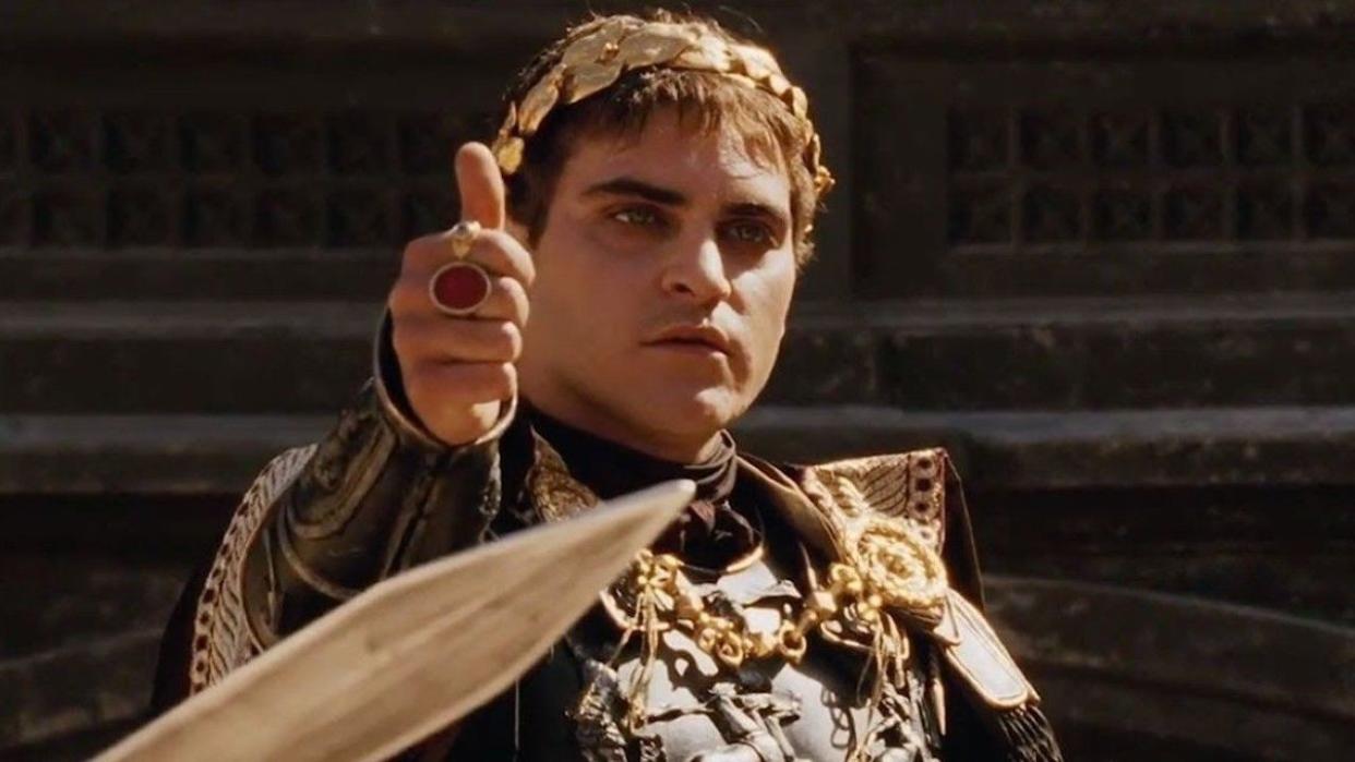  Joaquin Phoenix giving thumbs up in Gladiator. 