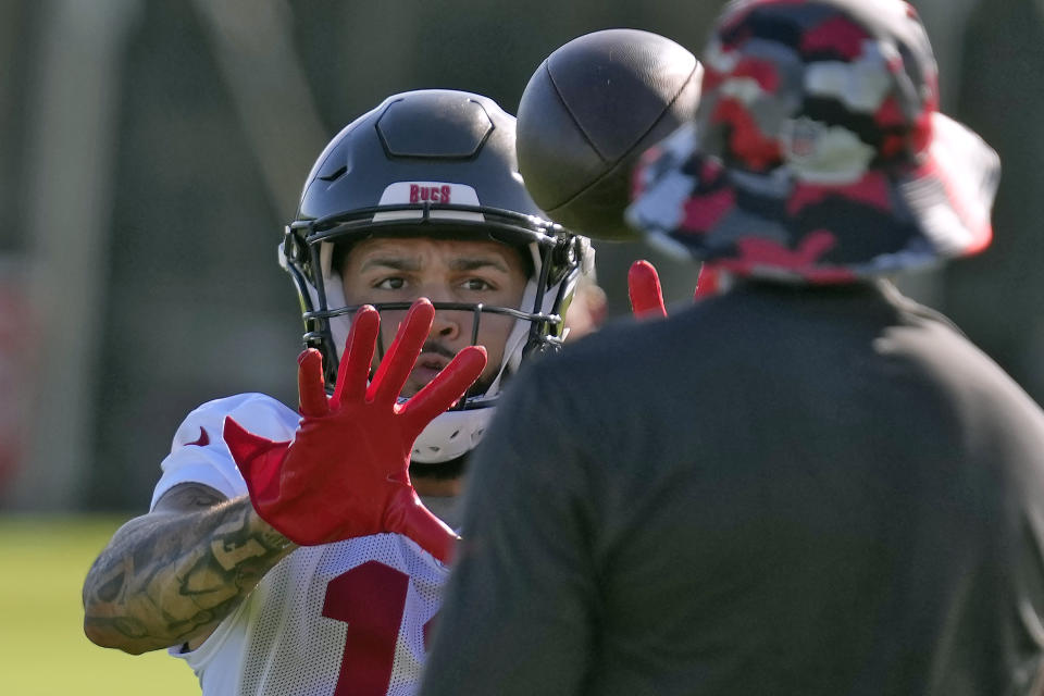 Tampa Bay Buccaneers wide receiver Mike Evans makes a catch during an NFL football training camp practice Wednesday, July 27, 2022, in Tampa, Fla. (AP Photo/Chris O'Meara)