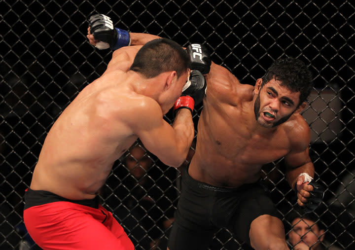 BELO HORIZONTE, BRAZIL - JUNE 23: (R-L) Hugo "Wolverine" Viana punches John Teixeira during their UFC 147 featherweight bout at Estadio Jornalista Felipe Drummond on June 23, 2012 in Belo Horizonte, Brazil.