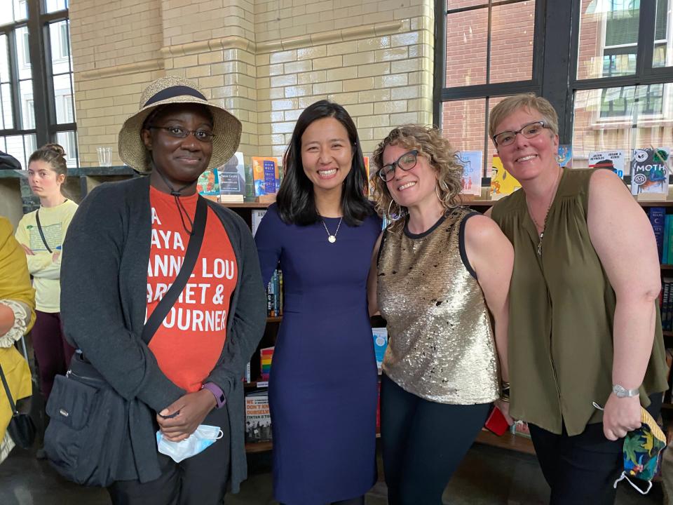 (Left to Right) Worker-owner Talia Whyte, Boston Mayor Michelle Wu, worker-owners Ana Crowley and Judy McClure at Rozzie Bound Co-Op in Roslindale, Massachusetts.