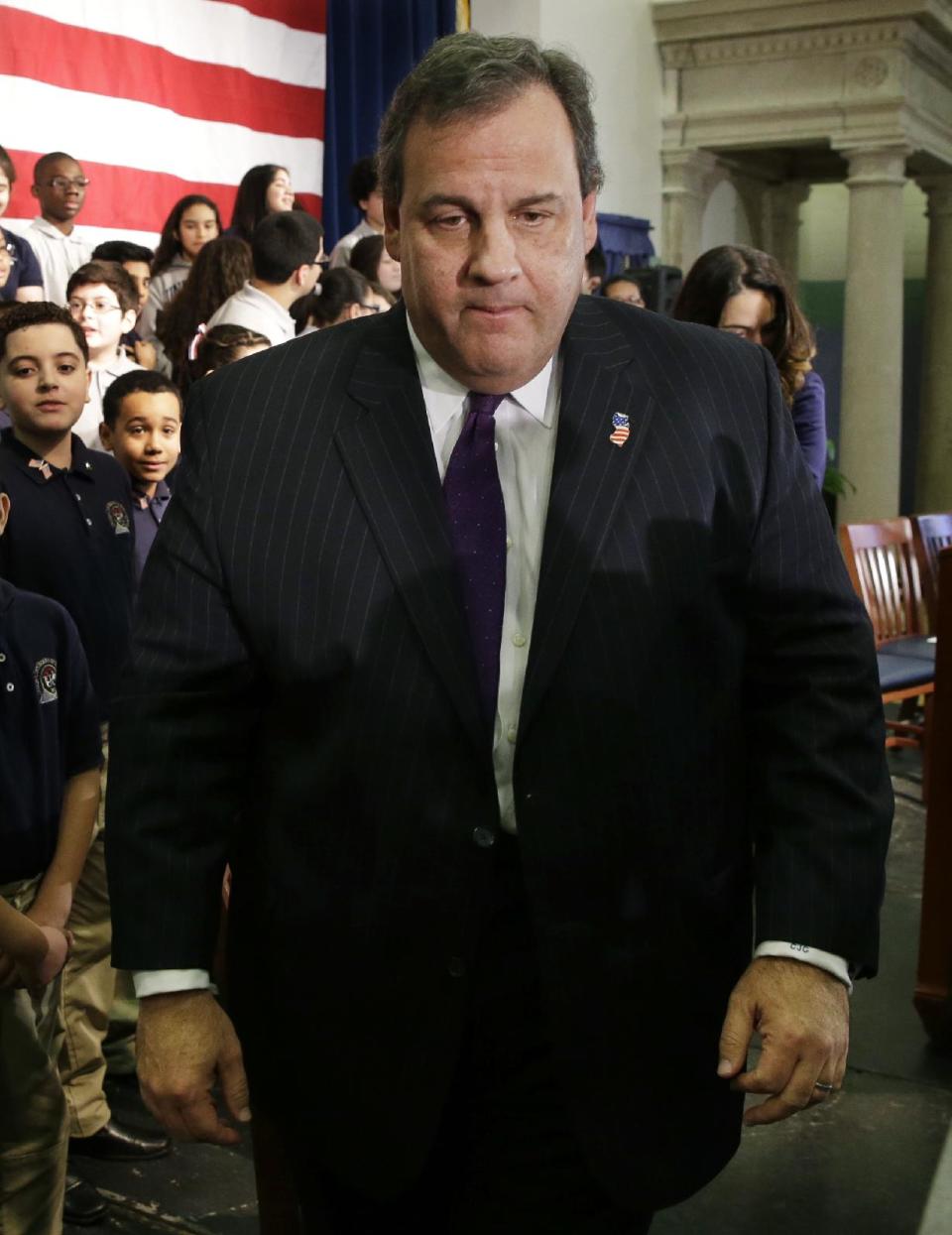 New Jersey Gov. Chris Christie walks from a gathering with school children in Union City, N.J., Tuesday, Jan. 7, 2014. A top aide to Christie is linked through emails and text messages to a seemingly deliberate plan to create traffic gridlock in Fort Lee, N.J., at the base of the George Washington Bridge after its mayor refused to endorse Christie for re-election. (AP Photo/Mel Evans)