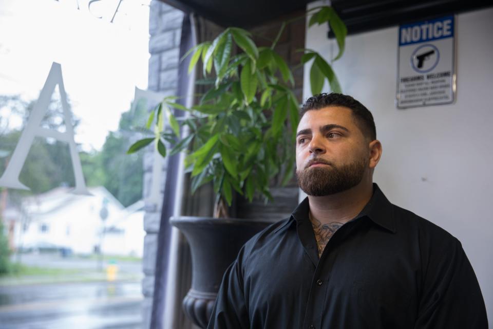 Roberto Minuta poses for the camera at his tattoo parlor, Casa Di Dolore in Newburgh, NY on June 21, 2019.