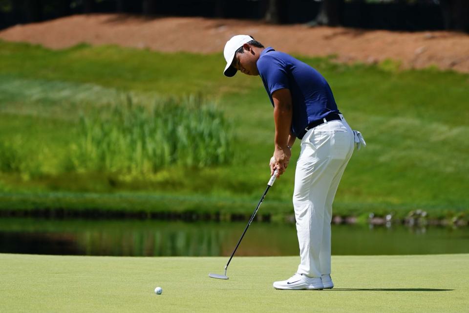 Tom Kim, of South Korea, putts on the eighth green during the final round of the Travelers Championship golf tournament at TPC River Highlands, Sunday, June 25, 2023, in Cromwell. (AP Photo/Frank Franklin II)