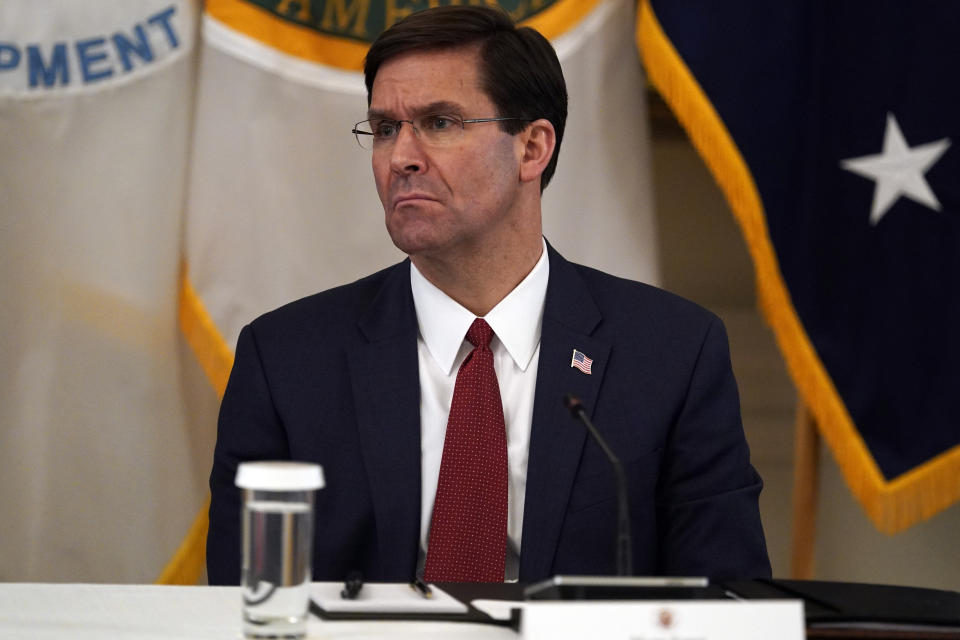 FILE - In this May 19, 2020, file photo Defense Secretary Mark Esper listens during a Cabinet Meeting with President Donald Trump in the East Room of the White House in Washington. Esper and Army Secretary Ryan McCarthy, both former Army officers, put out word that they are “open to a bipartisan discussion” of renaming Army bases like North Carolina’s Fort Bragg that honor Confederate officers associated by some with the racism of that tumultuous time. (AP Photo/Evan Vucci, FIle)