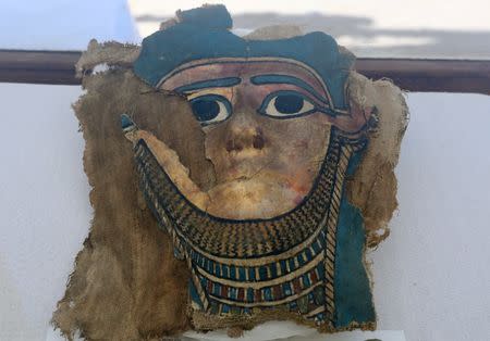 A broken mummy mask is seen inside a glass casing, on display near Egypt's Saqqara necropolis, in Giza Egypt July 14, 2018. REUTERS/Mohamed Abd El Ghany