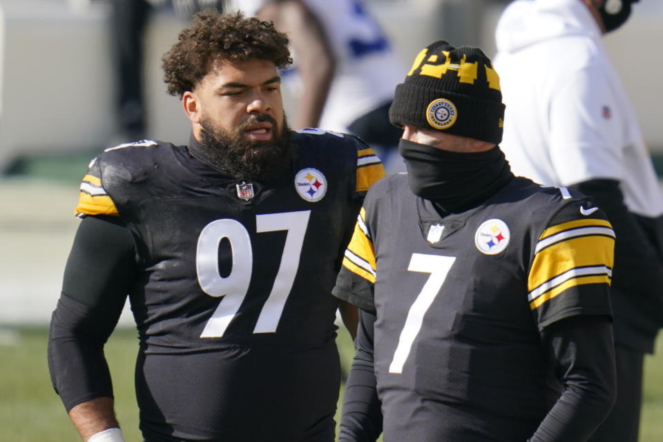 Pittsburgh Steelers quarterback Ben Roethlisberger (7) and defensive end Cameron Heyward (97) greet each other as the teams warm up before an NFL football game against the Indianapolis Colts, Sunday, Dec. 27, 2020, in Pittsburgh. (AP Photo/Gene J. Puskar)