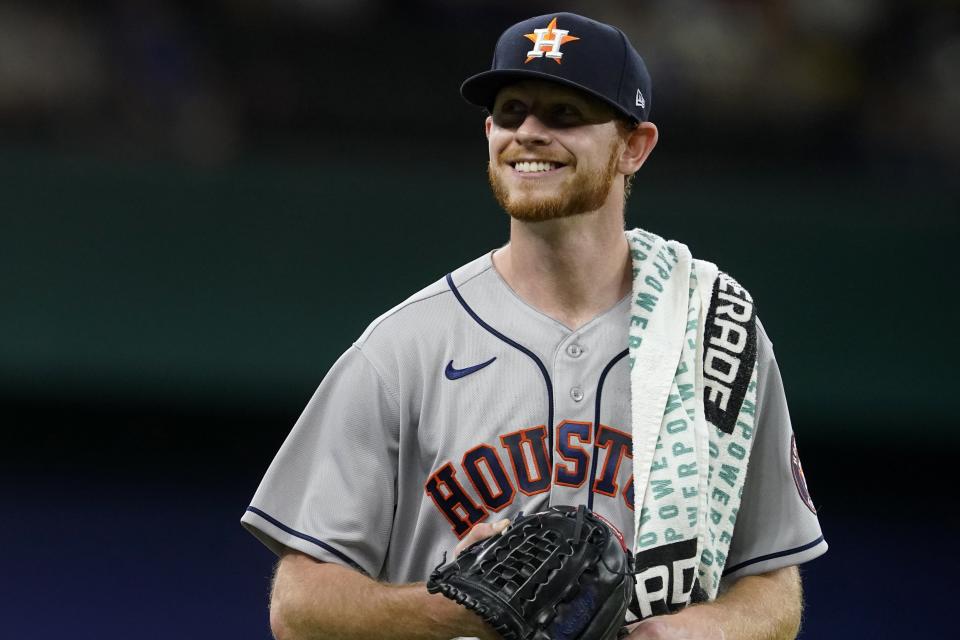 Houston Astros starting pitcher Tyler Ivey walks to the dugout before the team's baseball game against the Texas Rangers in Arlington, Texas, Friday, May 21, 2021. Ivey made his major league debut in the game. (AP Photo/Tony Gutierrez)