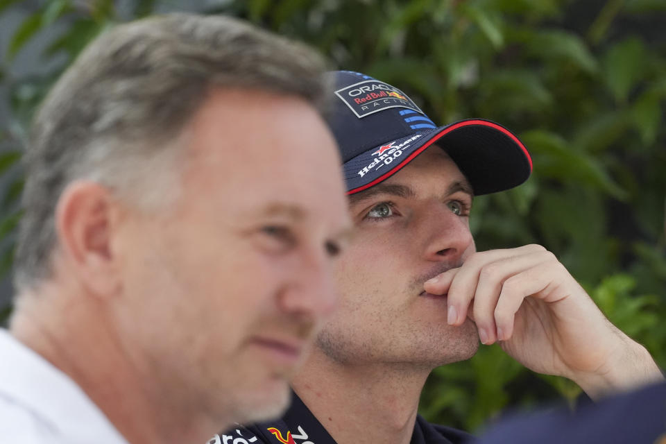 Red Bull driver Max Verstappen of the Netherlands reacts while talking to Red Bull team principal Christian Horner, left, outside their team garage ahead of the Australian Formula One Grand Prix at Albert Park, Melbourne, Australia, Thursday, March 21, 2024. (AP Photo/Asanka Brendon Ratnayake)