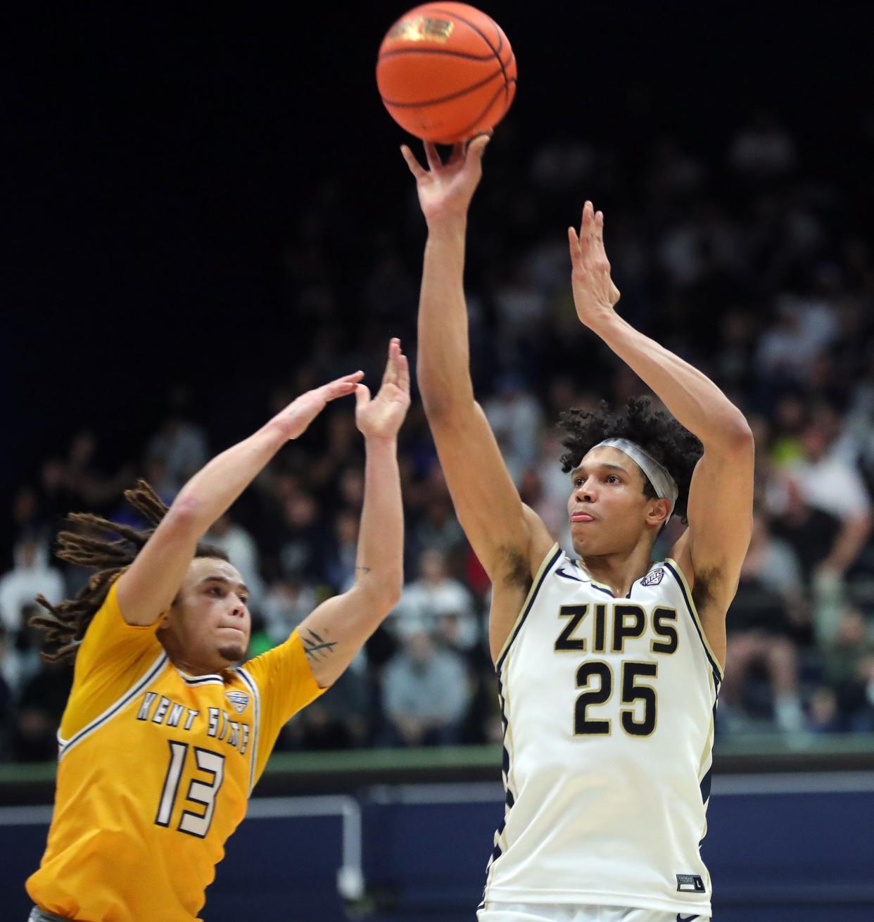 Akron Zips forward Enrique Freeman shoots over Kent State guard Jalen Sullinger in the second half, Friday, Feb. 23, 2024.