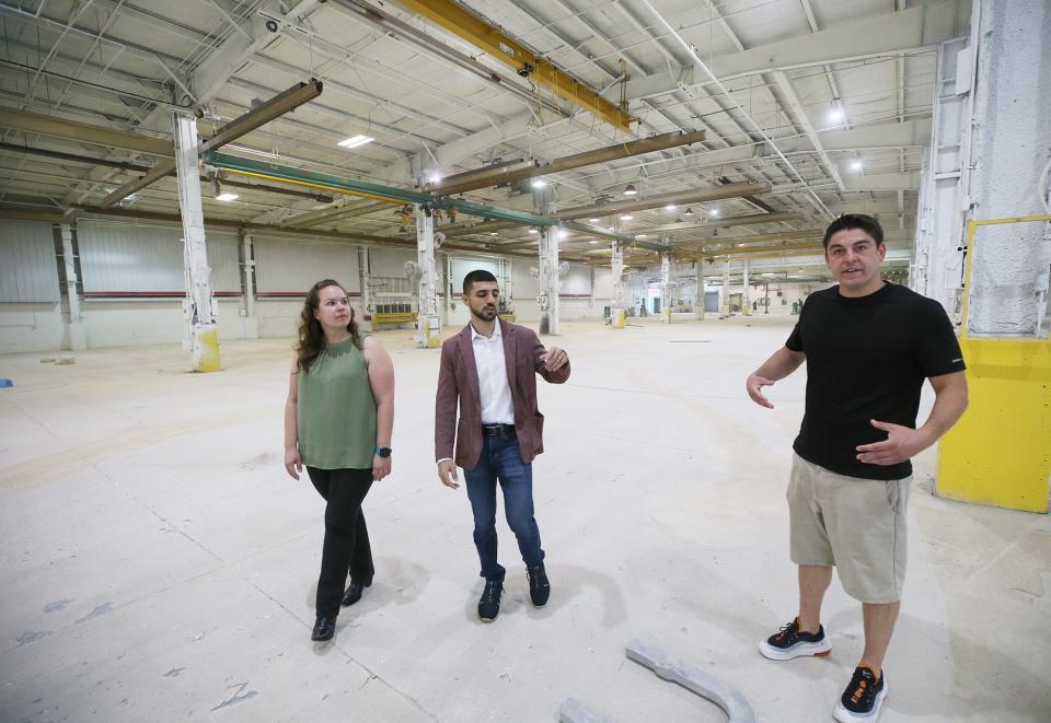 Ellen Stouffer, HR manager and Ash Abbas, president and Fred Guerra, co-owner of Jetpack, tour the renovations at the former Waltco building in August. The company's Akron-based vitamin/nutrient fulfillment distribution center moved to the Tallmadge facility.