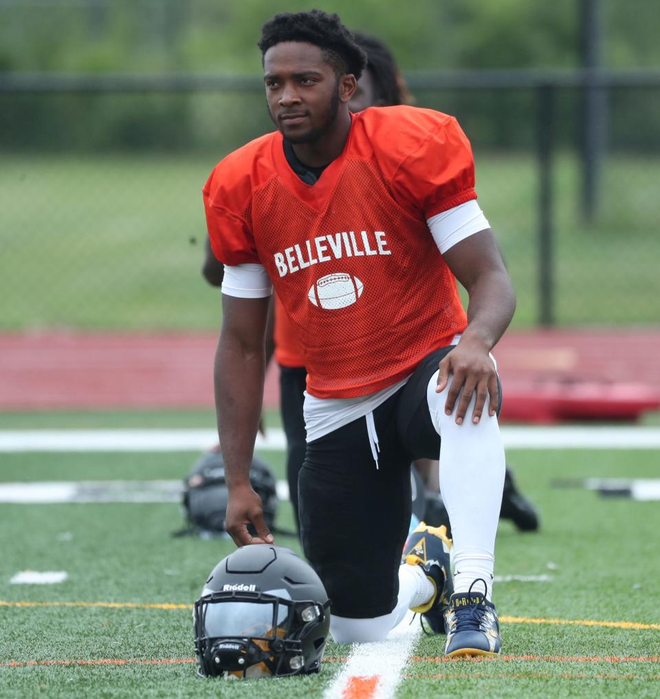 Belleville running back Jeremiah Beasley stretches before practice Tuesday, August 15, 2023.