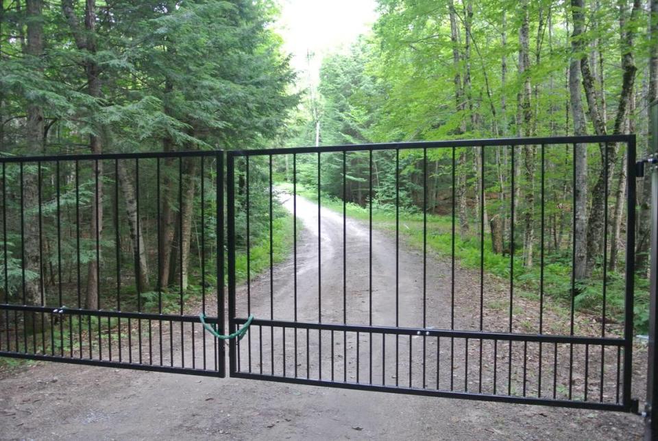 The gate in the long driveway leading to Ghislaine Maxwell’s property was shut and locked Thursday afternoon.