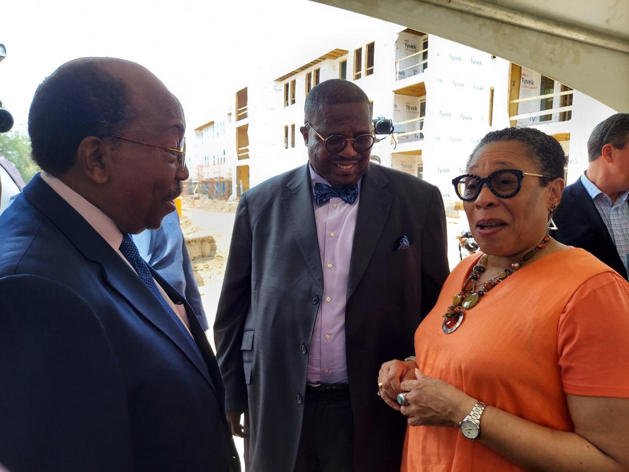 Tallahassee City Commissioner Curtis Richardson, left, School Board Member Darryl Jones, center, talk with U.S. Department of Housing and Urban Development Secretary Marcia L. Fudge during an on-site visit of the redevelopment of the Orange Avenue Apartments.
(Photo: Vaughn Wilson/Special to the Democrat)