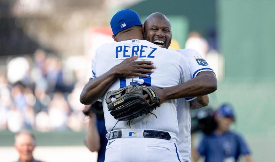 Former Kansas City Royals center fielder Lorenzo Cain hugs former teammate Salvador Perez after throwing out the ceremonial first pitch during a retirement ceremony at Kauffman Stadium on Saturday, May 6, 2023, in Kansas City. Cain signed a ceremonial one-day contract to retire as a Royal.