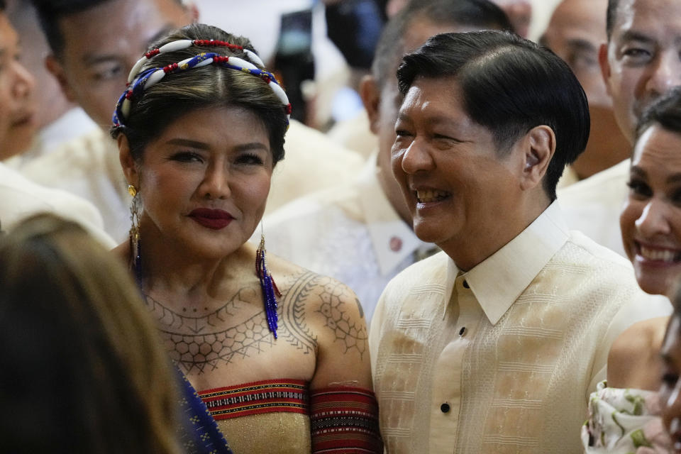 Philippine President Ferdinand Marcos Jr., right, stands beside his sister Senator Imee Marcos after he delivers his second state of the nation address at the House of Representatives in Quezon City, Philippines on Monday, July 24, 2023. (AP Photo/Aaron Favila)