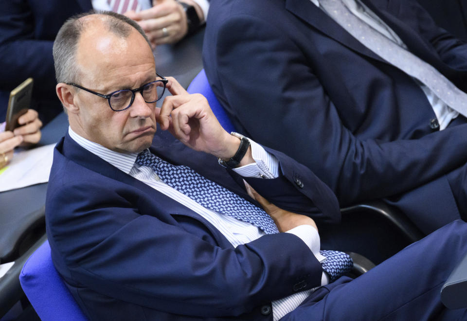 FILE - Friedrich Merz, Chairman of the German Christian Democratic (CDU) party and CDU/CSU parliamentary group in the German Bundestag, attends meeting of the German federal parliament, Bundestag, at the Reichstag building in Berlin, Germany, Wednesday, July 5, 2023. Germany's conservative opposition leader said Tuesday that large-scale migration is one of the country's biggest problems and one of the main reasons for the recent surge in support for the far right. (Bernd von Jutrczenka/dpa via AP, File)