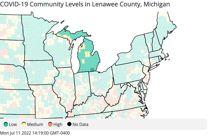Lenawee County and most of Michigan and Ohio are in the "low" community COVID-19 level, which is marked in green on this map. Counties in the "medium" level are in yellow, and those in the "high" level are in orange.